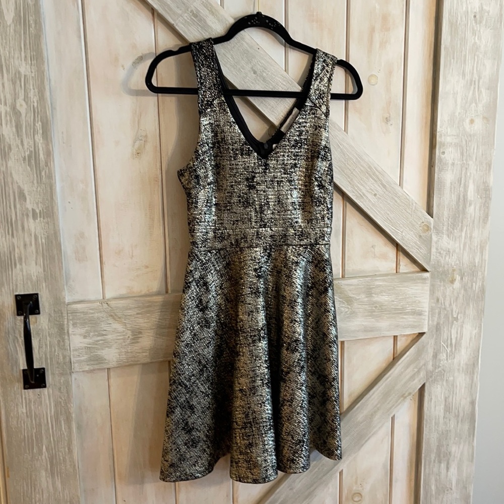 Black and gold fit and flare dress